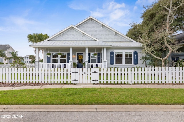 view of front of home featuring covered porch, a fenced front yard, and a gate