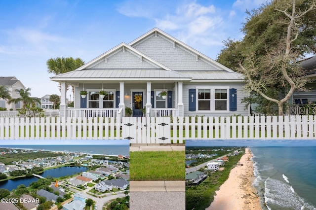 birds eye view of property featuring a residential view and a water view