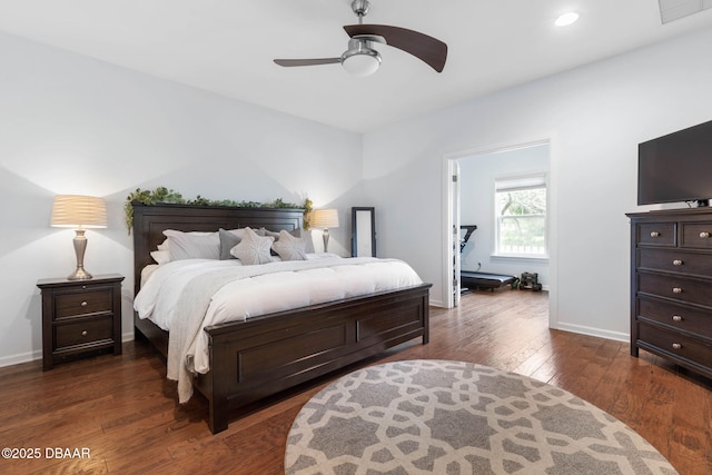 bedroom featuring visible vents, a ceiling fan, dark wood finished floors, and baseboards