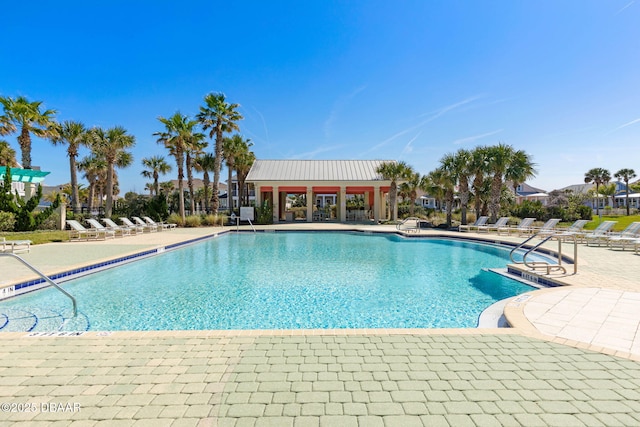 community pool featuring a patio area