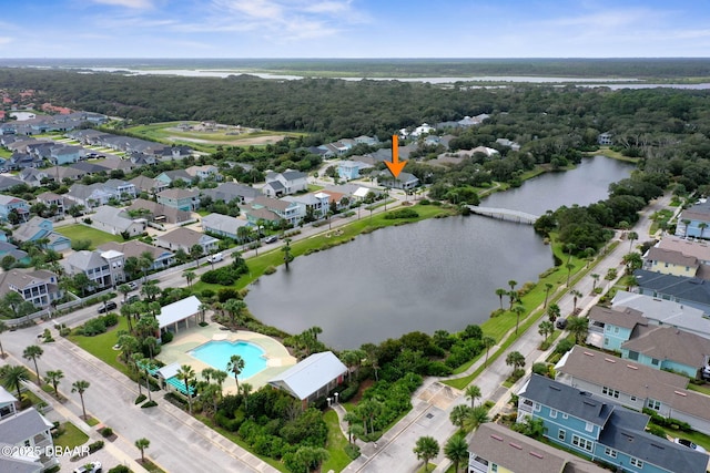 drone / aerial view featuring a water view and a residential view