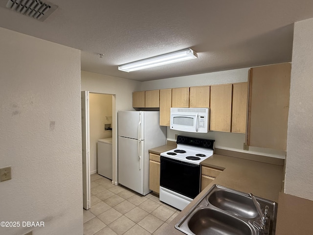 kitchen featuring light tile patterned floors, visible vents, a sink, a textured ceiling, and white appliances