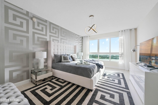 241 Riverside Dr Unit 2301, Holly Hill, FL 32117 - bedroom featuring a chandelier and baseboards