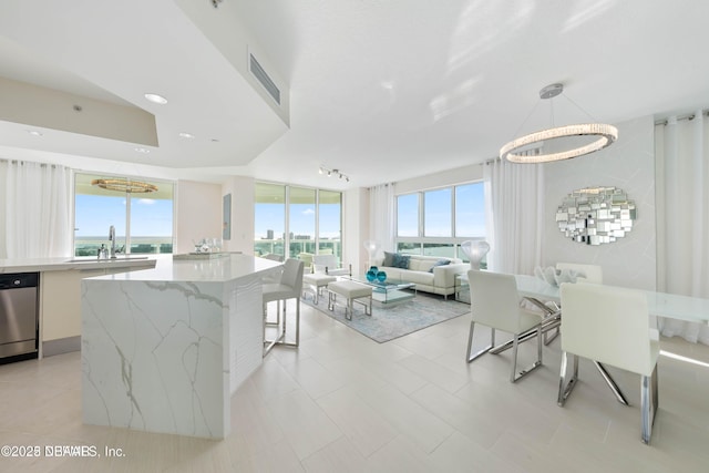 241 Riverside Dr Unit 2301, Holly Hill, FL 32117 - kitchen with modern cabinets, a sink, dishwasher, and plenty of natural light