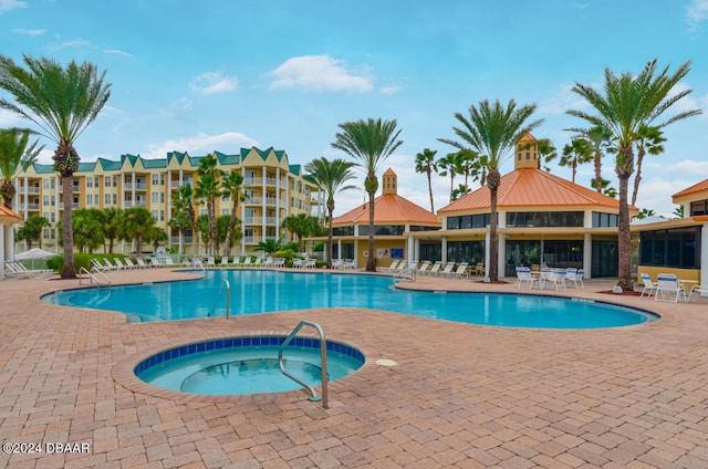 view of swimming pool with a gazebo, a hot tub, and a patio area