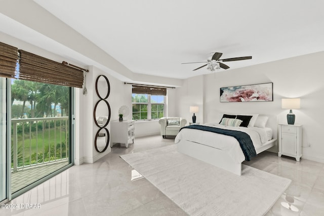 tiled bedroom with access to exterior and ceiling fan