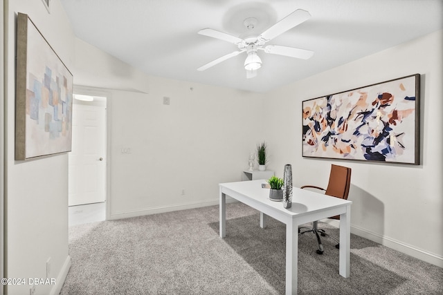 carpeted home office with ceiling fan