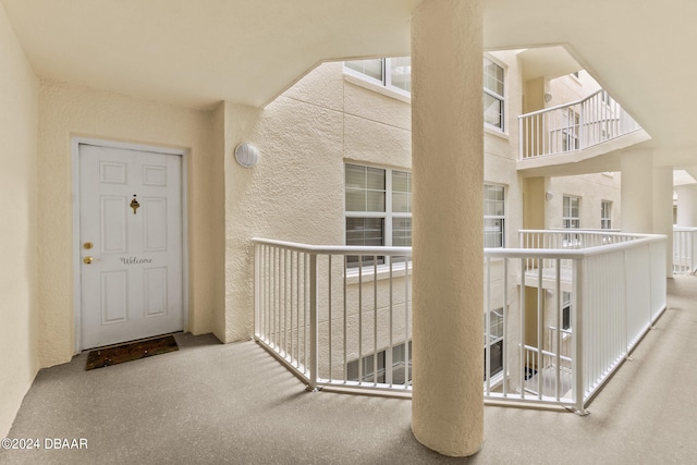 entrance to property with a balcony