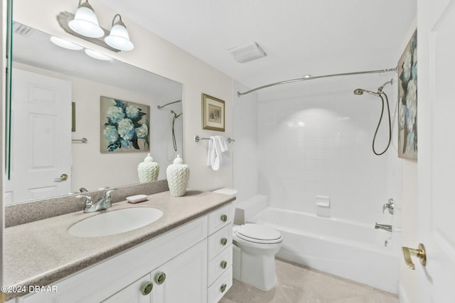 full bathroom with tile patterned flooring, vanity, tiled shower / bath combo, and toilet