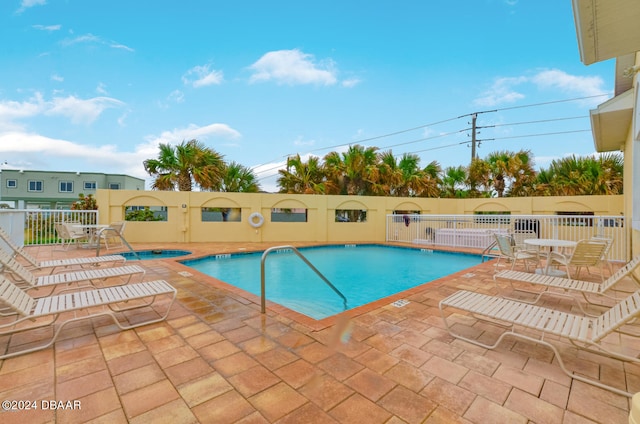 view of swimming pool featuring a patio area