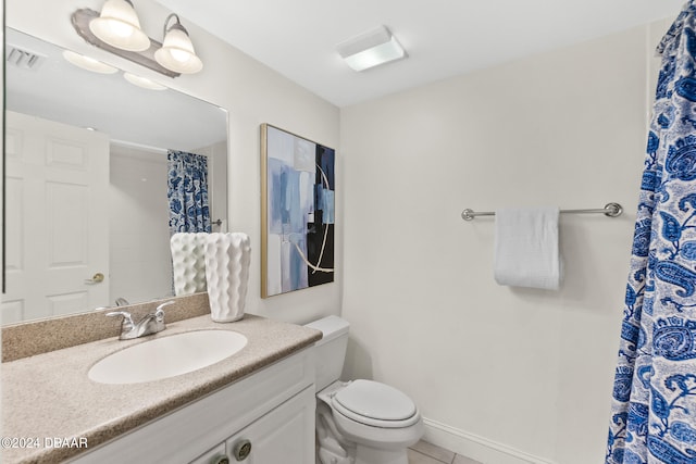 bathroom with toilet, a shower with curtain, vanity, and tile patterned flooring