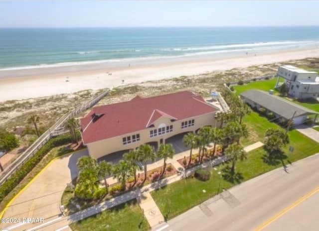 bird's eye view featuring a beach view and a water view