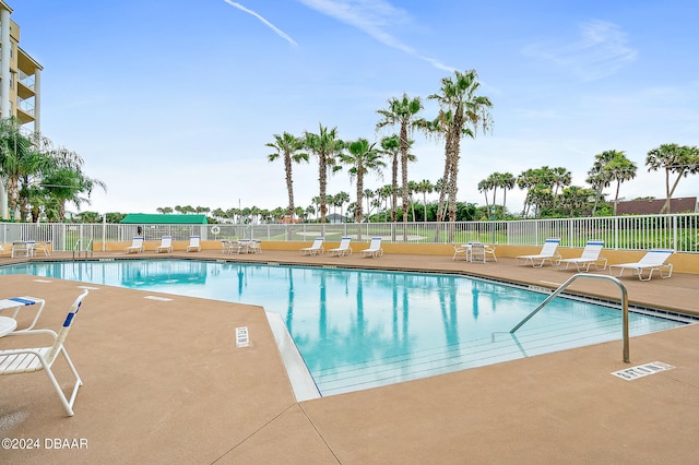 view of swimming pool featuring a patio