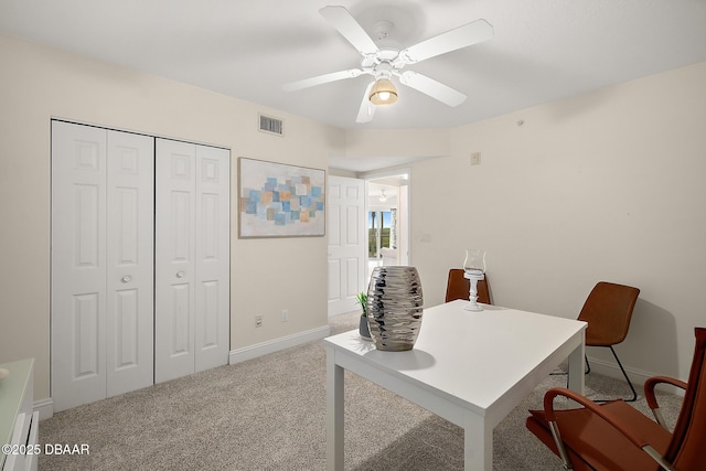 office featuring visible vents, ceiling fan, carpet floors, and baseboards