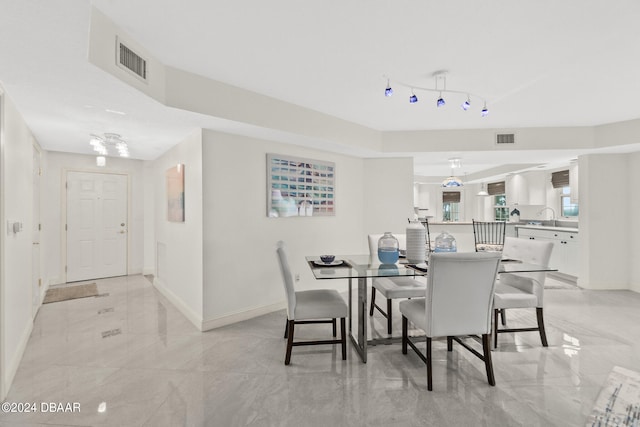 dining space featuring sink