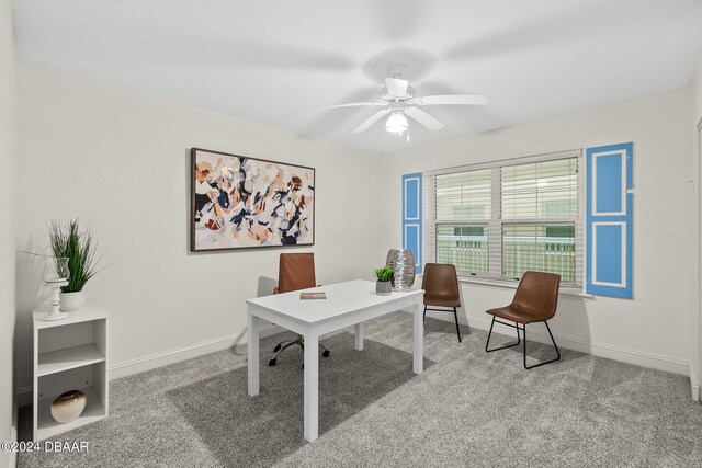 carpeted office with ceiling fan