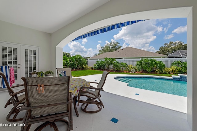 view of swimming pool featuring a patio