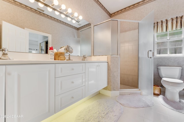 bathroom featuring toilet, tile patterned floors, ornamental molding, vanity, and walk in shower