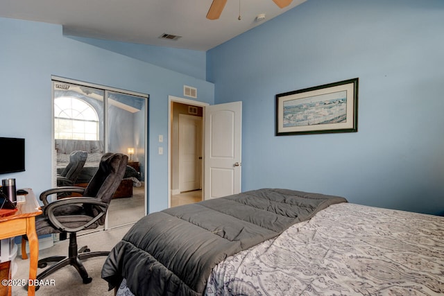 carpeted bedroom featuring lofted ceiling, a closet, and ceiling fan