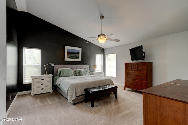 bedroom with ceiling fan, light colored carpet, and lofted ceiling