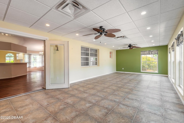 1927 Orange Tree Dr, Edgewater, FL 32141 - empty room featuring a ceiling fan, plenty of natural light, a paneled ceiling, recessed lighting, and baseboards