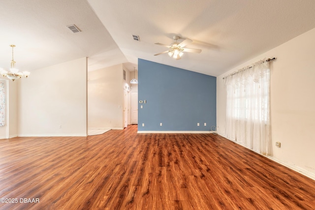 1927 Orange Tree Dr, Edgewater, FL 32141 - empty room with ceiling fan, a chandelier, wood finished floors, vaulted ceiling, and baseboards