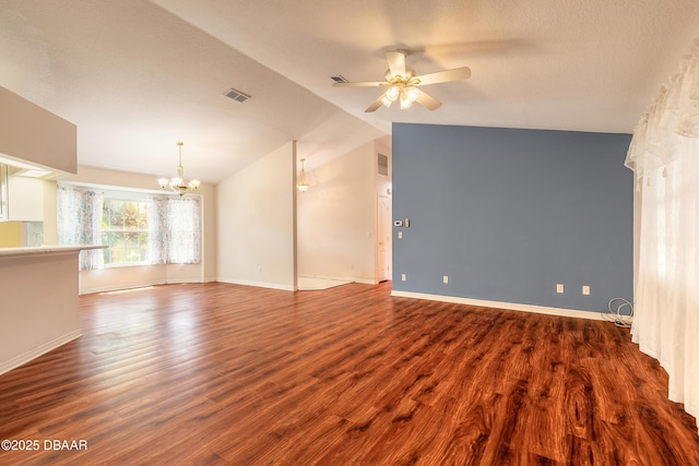 1927 Orange Tree Dr, Edgewater, FL 32141 - unfurnished living room with a chandelier, dark wood-style floors, ceiling fan, vaulted ceiling, and baseboards