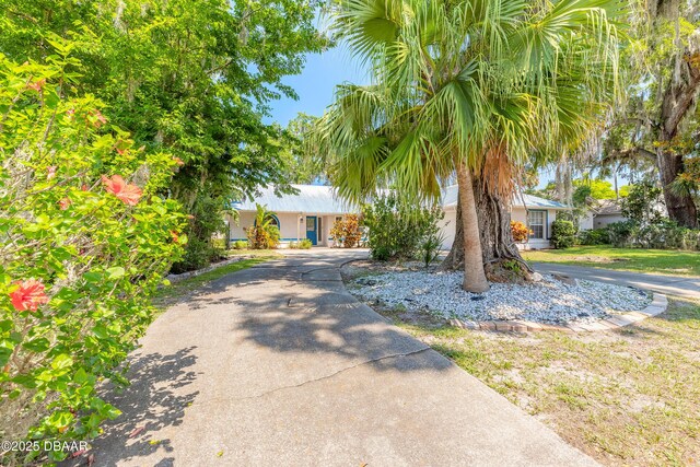 1927 Orange Tree Dr, Edgewater, FL 32141 - view of front of property featuring curved driveway and stucco siding