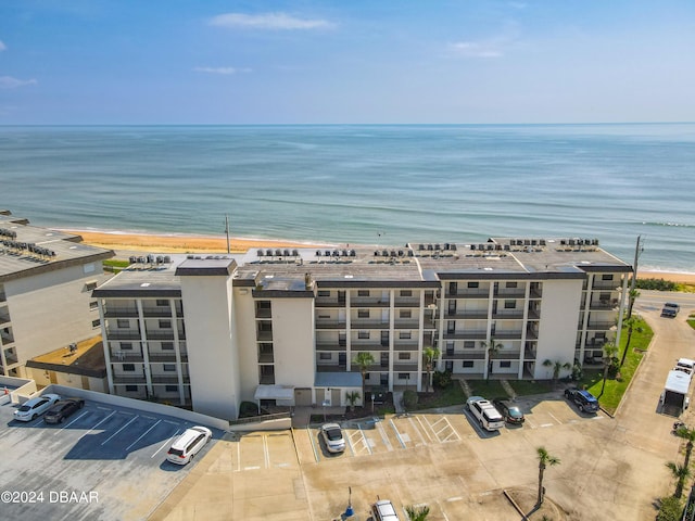 aerial view with a water view and a beach view