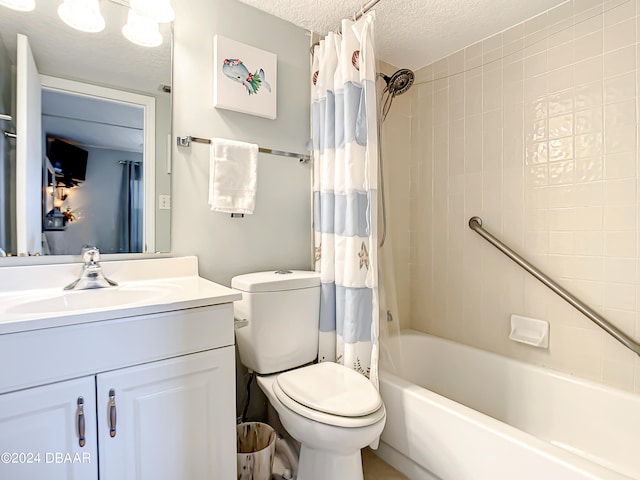 full bathroom with vanity, a textured ceiling, shower / bath combo, and toilet