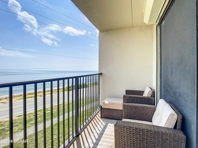 balcony featuring a water view