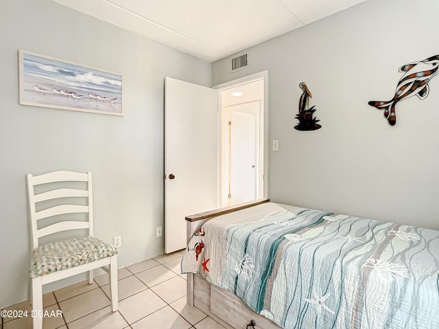 bedroom featuring light tile patterned flooring