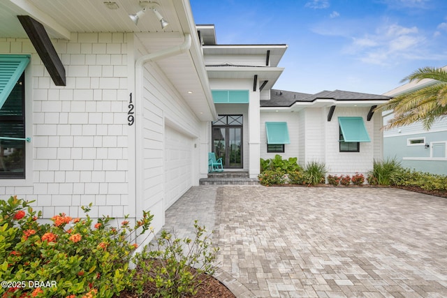 129 Seaside Pt, Flagler Beach, FL 32136 - entrance to property with decorative driveway and a garage