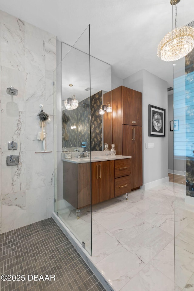 129 Seaside Pt, Flagler Beach, FL 32136 - bathroom with a chandelier, vanity, a walk in shower, and marble tiled floors