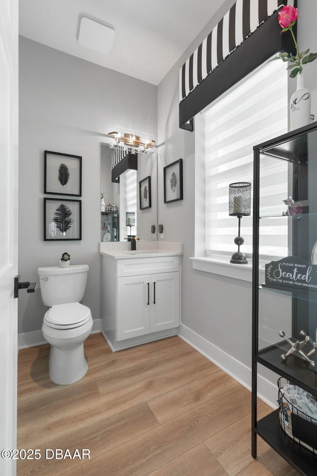 129 Seaside Pt, Flagler Beach, FL 32136 - bathroom featuring vanity and wood finished floors