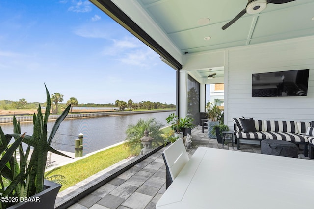 129 Seaside Pt, Flagler Beach, FL 32136 - balcony with a ceiling fan and an outdoor hangout area