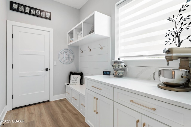 129 Seaside Pt, Flagler Beach, FL 32136 - mudroom with light wood-style flooring and baseboards