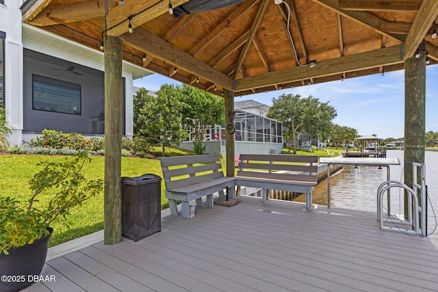 129 Seaside Pt, Flagler Beach, FL 32136 - wooden terrace with a water view, a gazebo, and ceiling fan