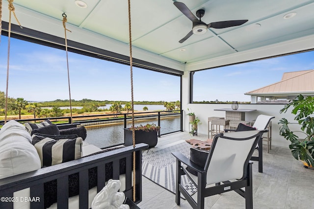 129 Seaside Pt, Flagler Beach, FL 32136 - deck with an outdoor living space, a water view, a ceiling fan, and a patio