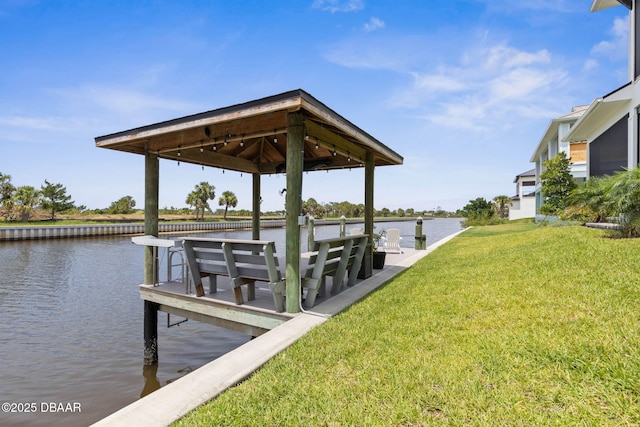 129 Seaside Pt, Flagler Beach, FL 32136 - dock area with a gazebo, a water view, and a lawn