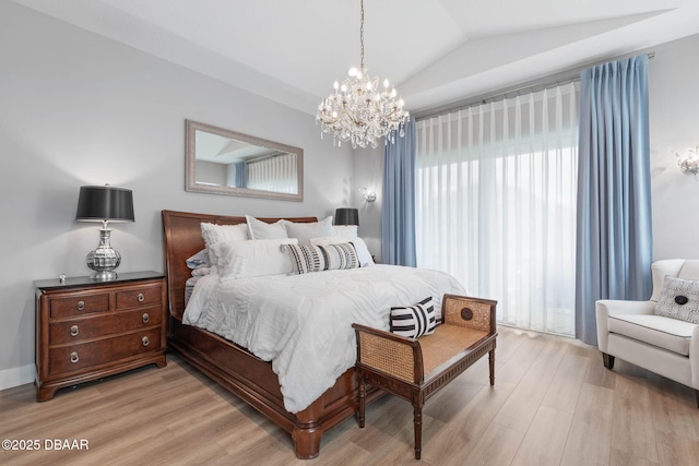 129 Seaside Pt, Flagler Beach, FL 32136 - bedroom with a chandelier, light wood-type flooring, and vaulted ceiling