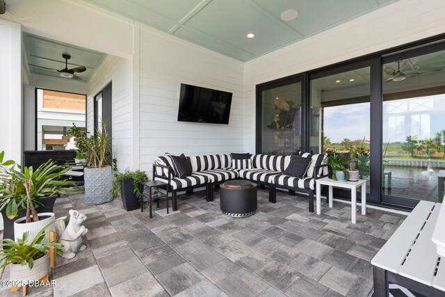 129 Seaside Pt, Flagler Beach, FL 32136 - view of patio / terrace with a ceiling fan and an outdoor hangout area