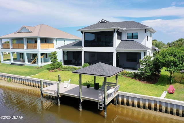 129 Seaside Pt, Flagler Beach, FL 32136 - back of house with a water view, a balcony, a sunroom, and a shingled roof