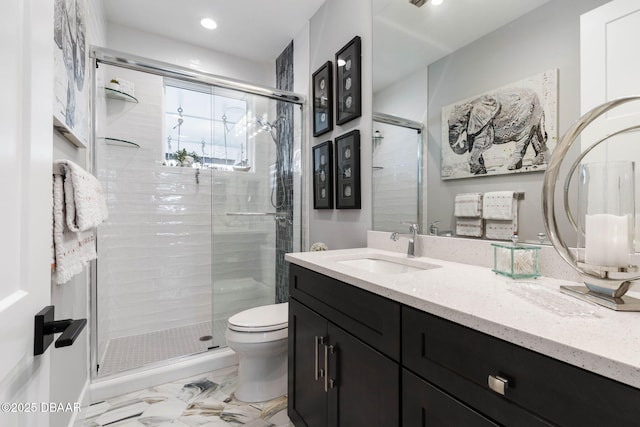 129 Seaside Pt, Flagler Beach, FL 32136 - bathroom with vanity, a shower stall, recessed lighting, and marble finish floors