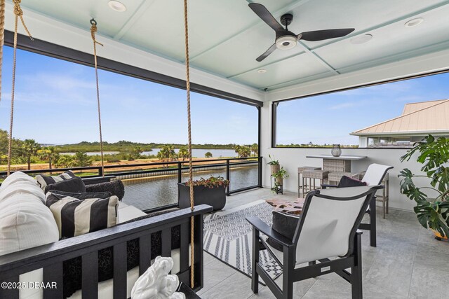 129 Seaside Pt, Flagler Beach, FL 32136 - deck featuring an outdoor hangout area, a water view, ceiling fan, and a patio