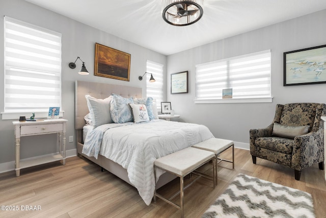 129 Seaside Pt, Flagler Beach, FL 32136 - bedroom with light wood-style floors and baseboards
