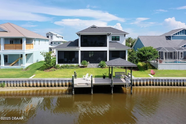 129 Seaside Pt, Flagler Beach, FL 32136 - back of house featuring a water view, a sunroom, roof with shingles, and a lawn