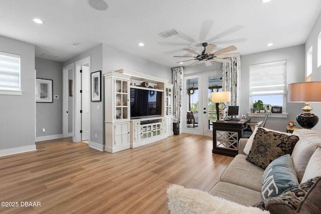 129 Seaside Pt, Flagler Beach, FL 32136 - living area featuring light wood-type flooring, french doors, a ceiling fan, and recessed lighting