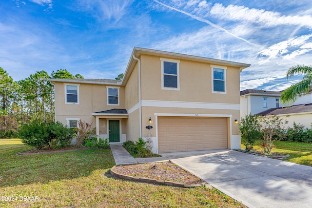 view of property featuring a garage and a front lawn