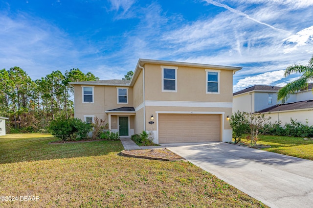 view of front property featuring a front yard and a garage